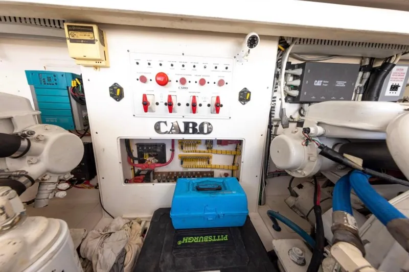 Slide: The Image of Interior of 2005 Cabo 40 Express yacht with cozy cabin and nautical decor. - 25