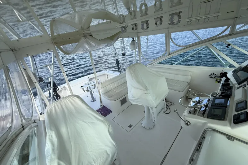 Slide: The Image of Engine room of a 2005 Cabo 40 Express boat, featuring a CAT marine engine. - 33