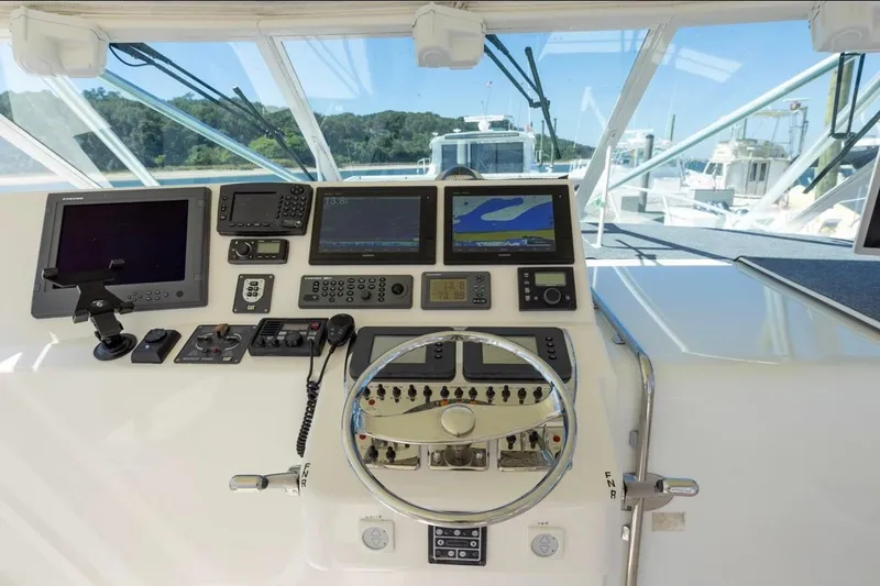 Slide: The Image of Helm of 2005 Cabo 40 Express boat with Garmin navigation systems. - 5