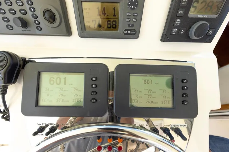 Slide: The Image of 2005 Cabo 40 Express boat interior with helm, seating, and ocean view. - 9