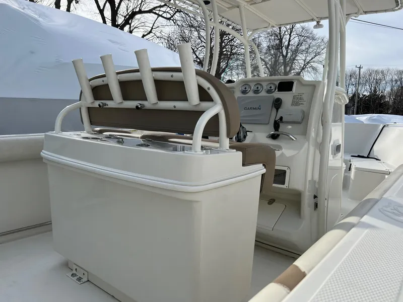 Slide: The Image of 2013 Sailfish 270 CC boat interior with helm and rod holders. - 10
