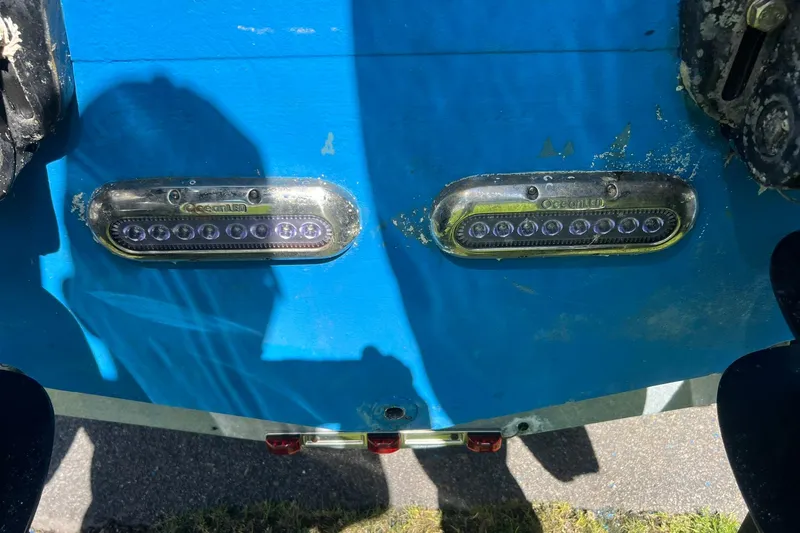 Slide: The Image of Underwater LED lights on a 2013 Sailfish 270 CC boat hull. - 22