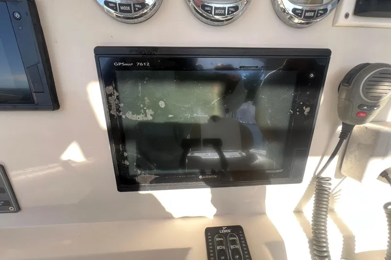 Slide: The Image of Garmin GPSmap 7612 on 2013 Sailfish 270 CC boat dashboard with radio and controls. - 32