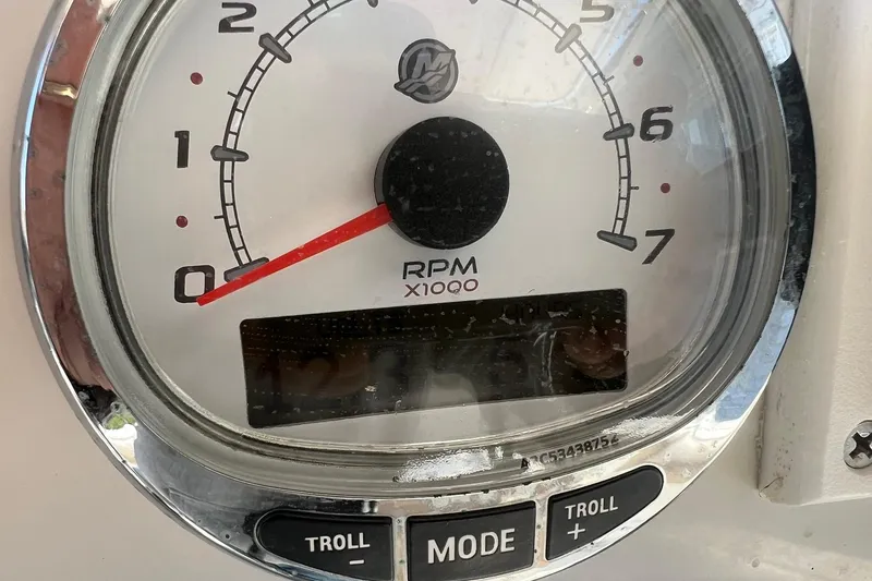 Slide: The Image of Tachometer of 2013 Sailfish 270 CC boat, showing RPM with troll mode buttons. - 34