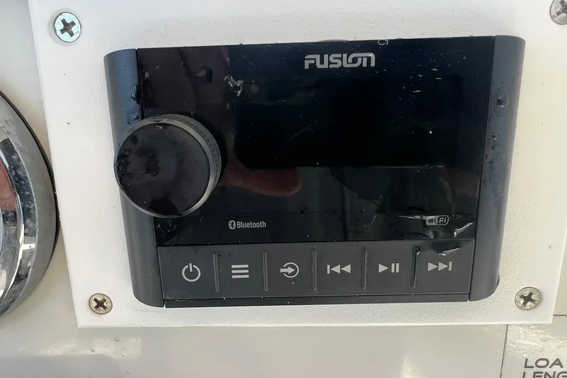 Slide: The Image of Fusion marine stereo system on 2013 Sailfish 270 CC boat dashboard. - 35