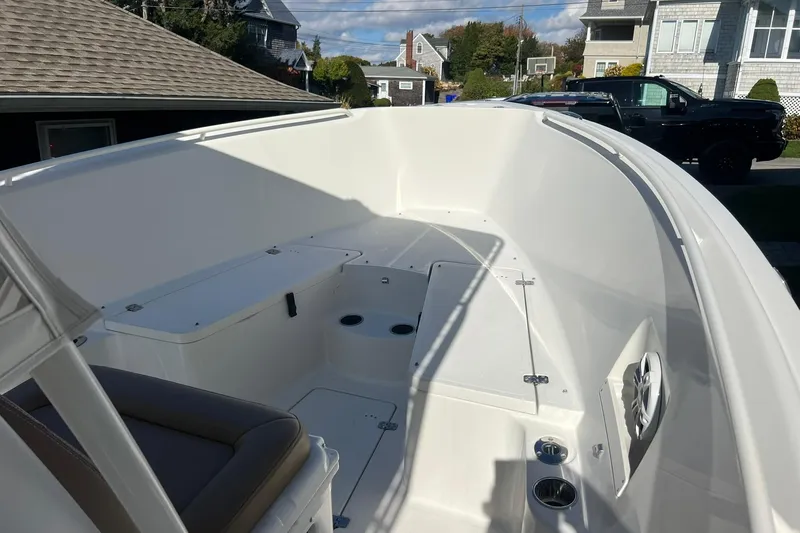 Slide: The Image of 2013 Sailfish 270 CC boat interior with seating and storage compartments. - 37