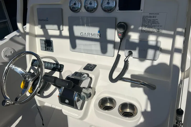 Slide: The Image of Control panel of a 2013 Sailfish 270 CC boat with Garmin navigation system. - 38