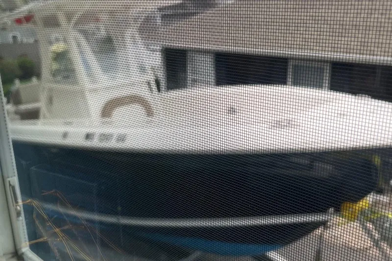 Slide: The Image of 2013 Sailfish 270 CC boat viewed through a window screen. - 4