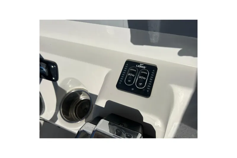 Slide: The Image of Control panel on 2013 Sailfish 270 CC boat dashboard with Lenco trim tab switches. - 40