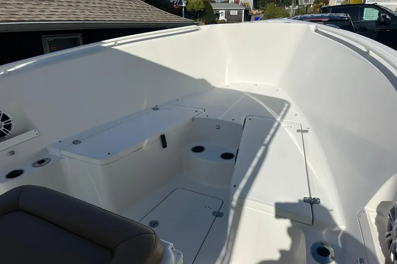 Slide: The Image of 2013 Sailfish 270 CC boat interior with seating and storage compartments. - 41