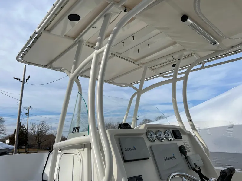 Slide: The Image of 2013 Sailfish 270 CC boat console with T-top and Garmin electronics. - 7