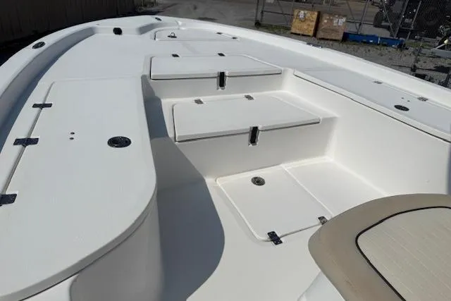 Slide: The Image of 2016 Sea Fox 240 Viper boat interior with storage compartments and seating. - 7