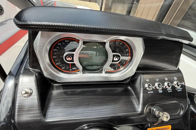 Slide: The Image of Dashboard of 2026 Scarab 195 LX boat with gauges and control switches. - 15