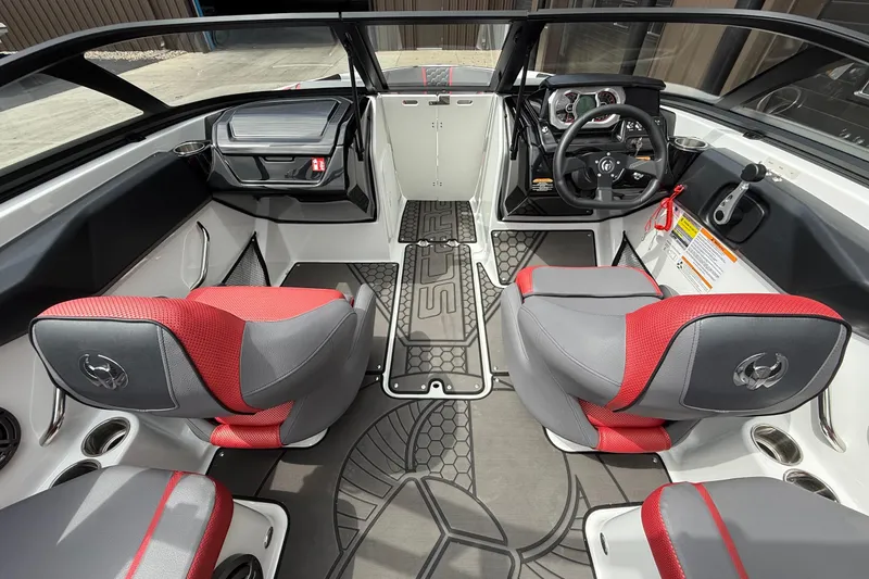 Slide: The Image of Interior of 2026 Scarab 195 LX boat with modern design and red-gray seating. - 18