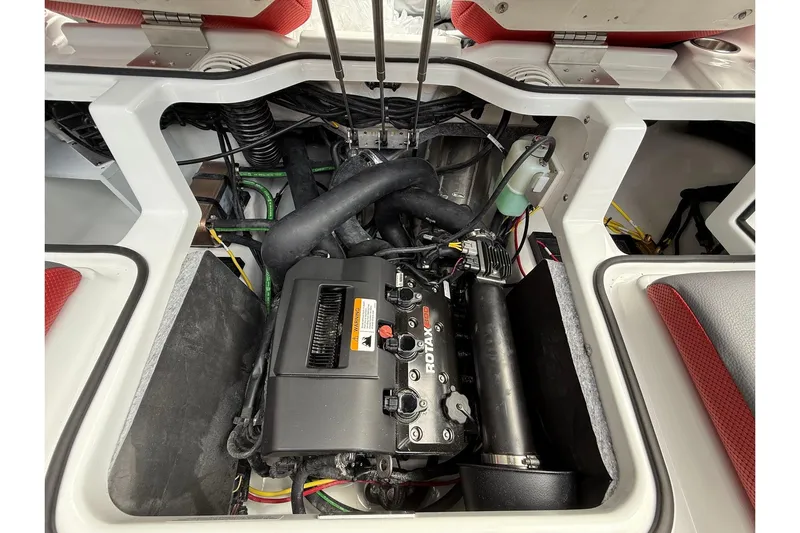 Slide: The Image of Engine compartment of 2026 Scarab 195 LX boat, featuring Rotax engine components. - 21