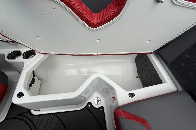 Slide: The Image of 2026 Scarab 195 LX boat interior storage compartment with red and gray seating. - 24