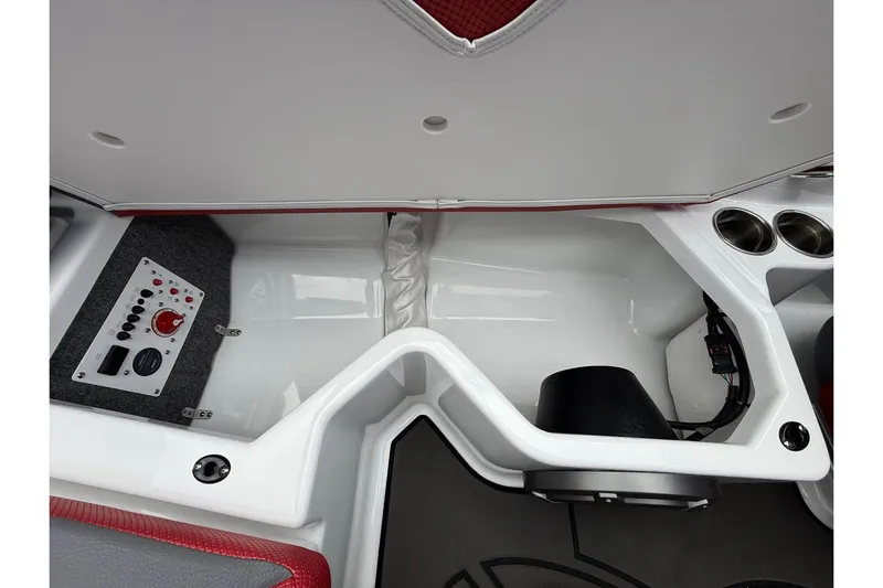 Slide: The Image of Interior view of 2026 Scarab 195 LX boat, featuring control panel and cup holders. - 25