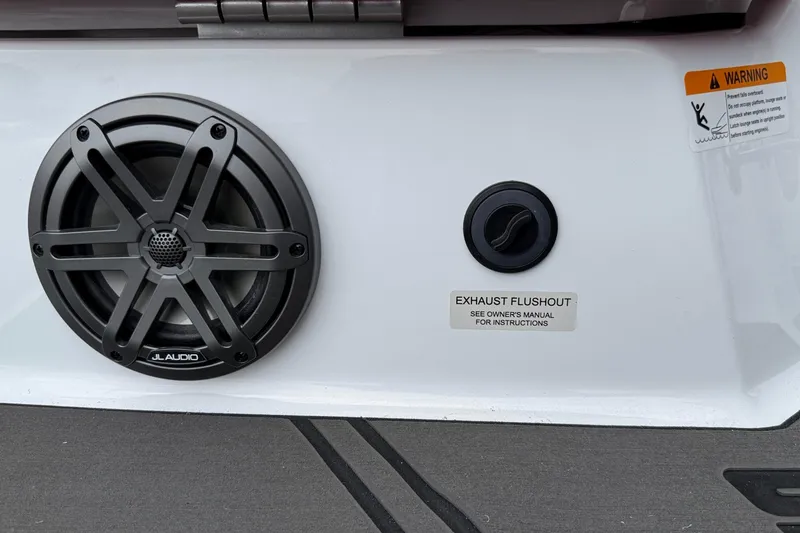 Slide: The Image of Speaker and exhaust flushout on 2026 Scarab 195 LX boat. - 29
