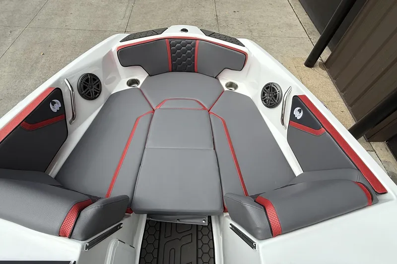 Slide: The Image of Luxurious interior of 2026 Scarab 195 LX boat with gray and red seating. - 3