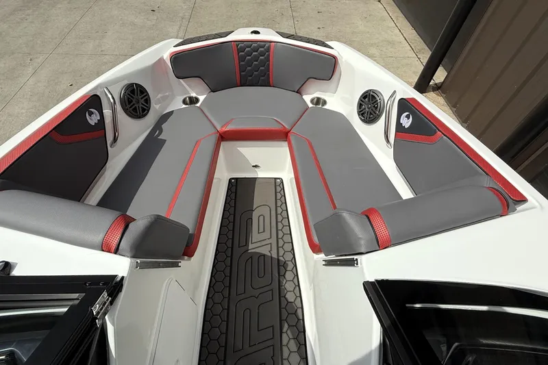 Slide: The Image of 2026 Scarab 195 LX boat interior with gray and red seating, modern design. - 4