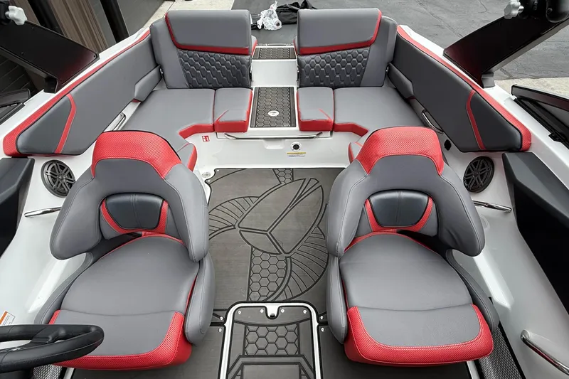 Slide: The Image of 2026 Scarab 195 LX boat interior with gray and red seating, modern design. - 7
