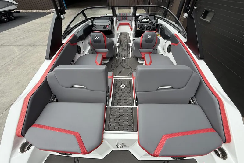 Slide: The Image of 2026 Scarab 195 LX boat interior with gray and red seating, modern design. - 8