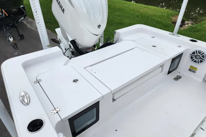 Slide: The Image of 2025 Sportsman Masters 247OE Bay Boat with Yamaha engine, featuring spacious deck and storage compartments. - 21