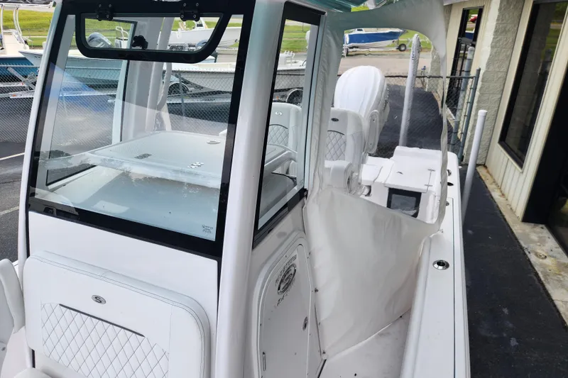 Slide: The Image of 2025 Sportsman Masters 247OE Bay Boat, sleek design, white interior, modern features. - 23