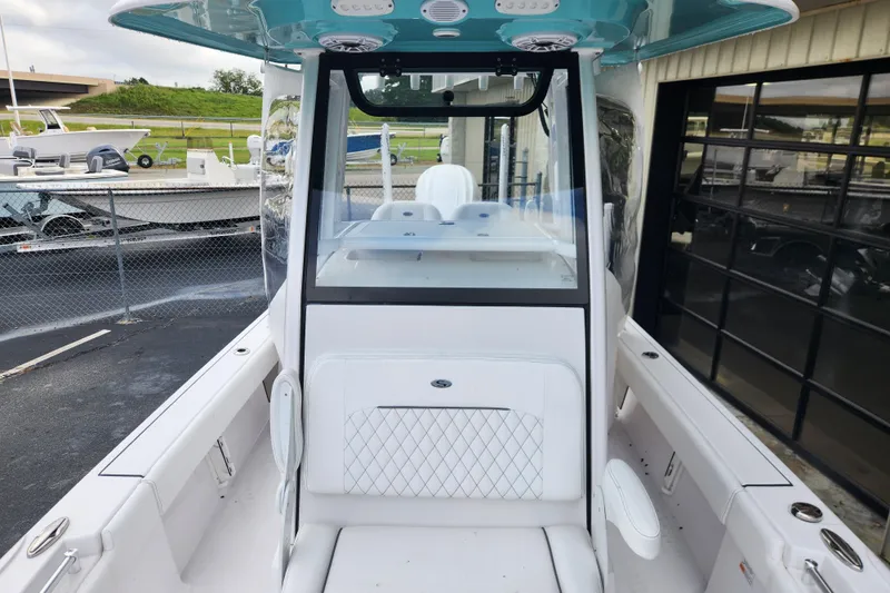 Slide: The Image of 2025 Sportsman Masters 247OE Bay Boat interior with modern design and seating. - 25