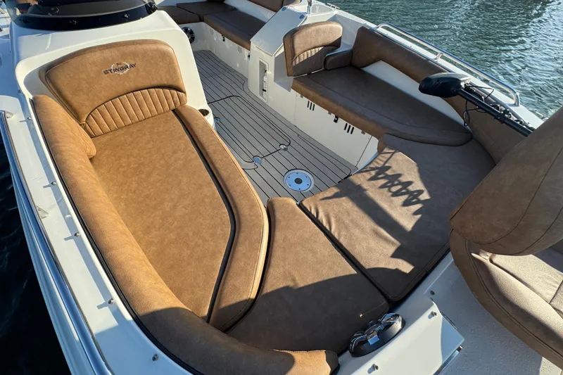 Slide: The Image of 2021 Stingray 192 SC boat interior with tan seating and spacious layout. - 12