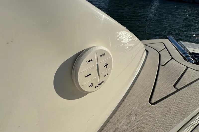 Slide: The Image of 2021 Stingray 192 SC boat with Fusion audio control panel by the water. - 28