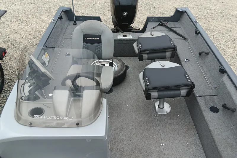 Slide: The Image of 2019 Tracker Pro Guide V-16 SC boat interior with seating and steering console. - 10
