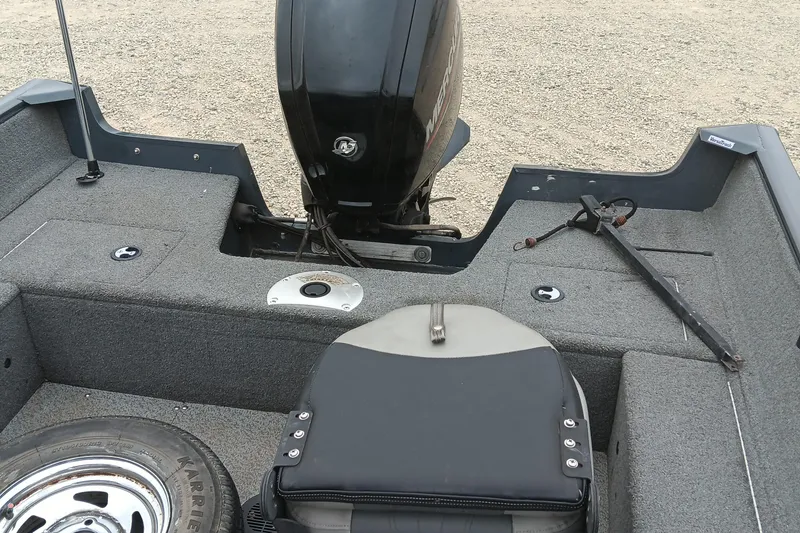 Slide: The Image of 2019 Tracker Pro Guide V-16 SC boat interior with motor and seating. - 12