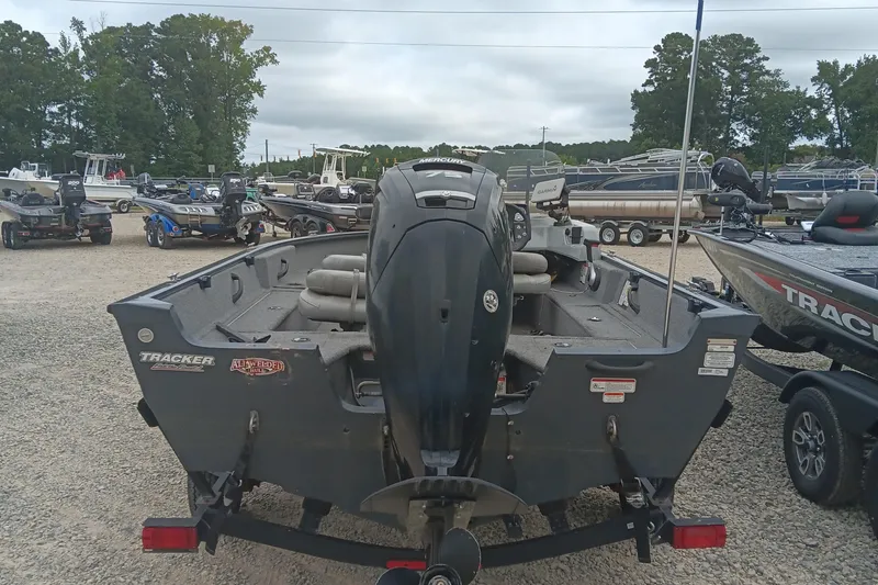 Slide: The Image of 2019 Tracker Pro Guide V-16 SC boat with Mercury outboard motor in a dealership lot. - 5