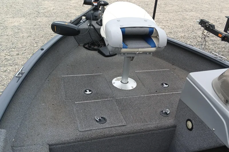 Slide: The Image of 2019 Tracker Pro Guide V-16 SC boat interior with seating and storage compartments. - 7