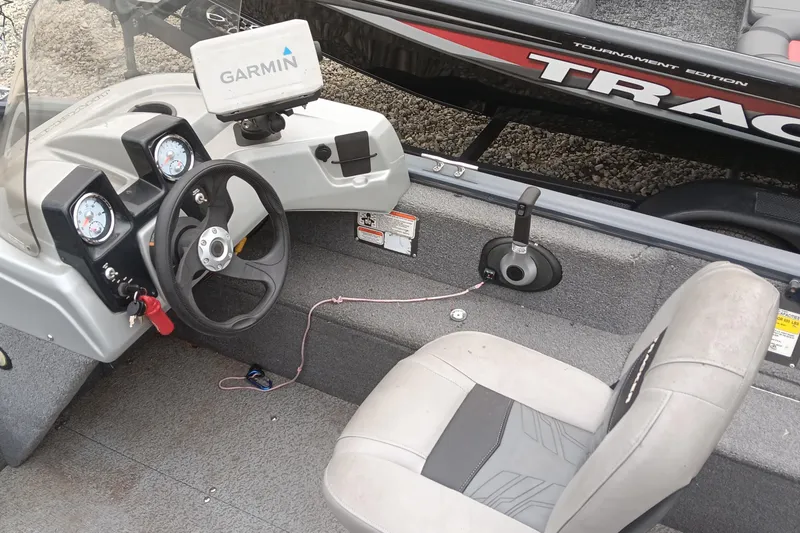 Slide: The Image of 2019 Tracker Pro Guide V-16 SC boat interior with Garmin GPS and steering console. - 8