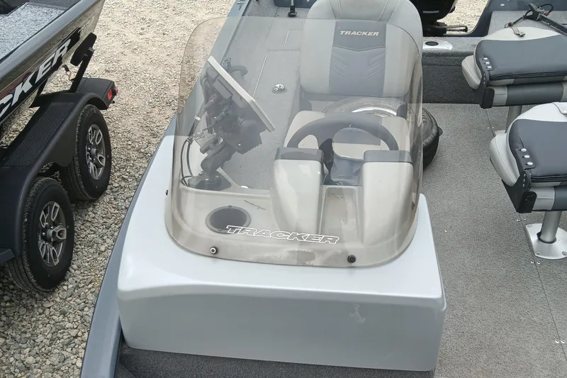 Slide: The Image of 2019 Tracker Pro Guide V-16 SC boat interior with steering console and seating. - 9