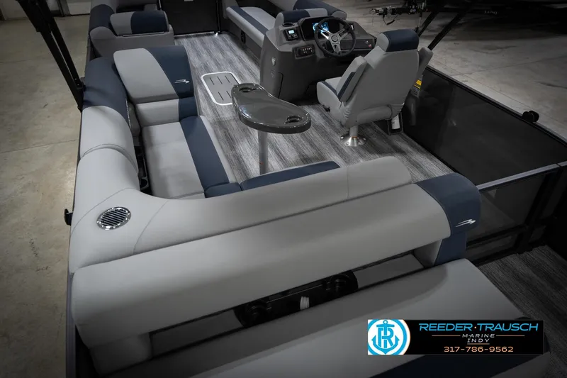 Slide: The Image of 2026 Bennington 23 SLJ pontoon boat interior with gray seating and modern dashboard. - 14