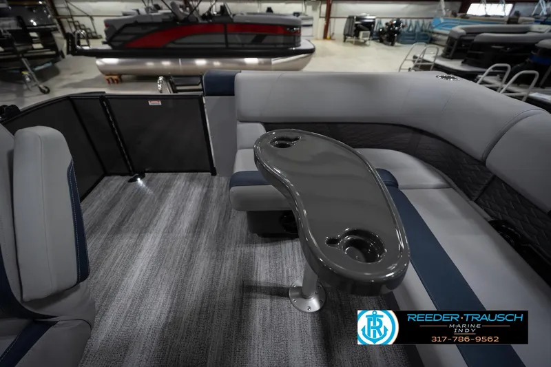 Slide: The Image of 2026 Bennington 23 SLJ pontoon boat interior with modern seating and steering console. - 17