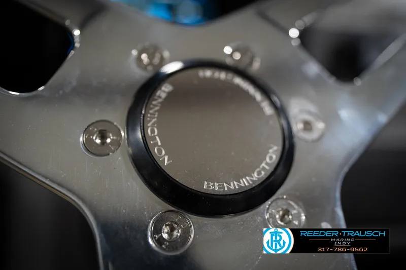 Slide: The Image of 2026 Bennington 23 SLJ boat dashboard with steering wheel and control panel. - 34