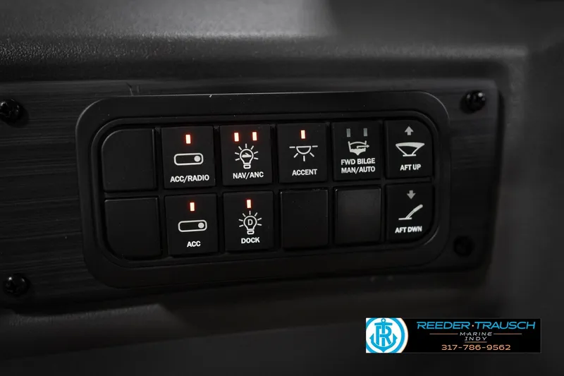 Slide: The Image of Close-up of Bennington 23 SLJ 2026 steering wheel with Reeder-Trausch Marine logo. - 35