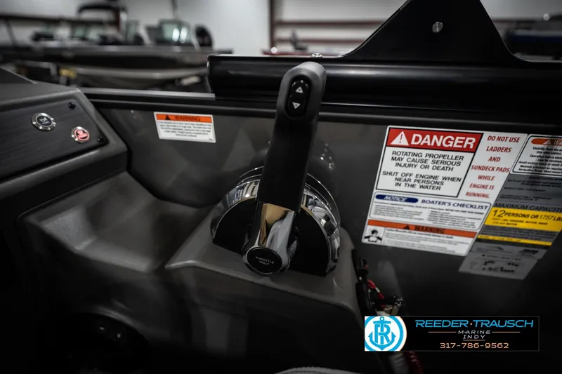 Slide: The Image of Dashboard buttons on a 2026 Bennington 23 SLJ boat, featuring horn and power controls. - 40