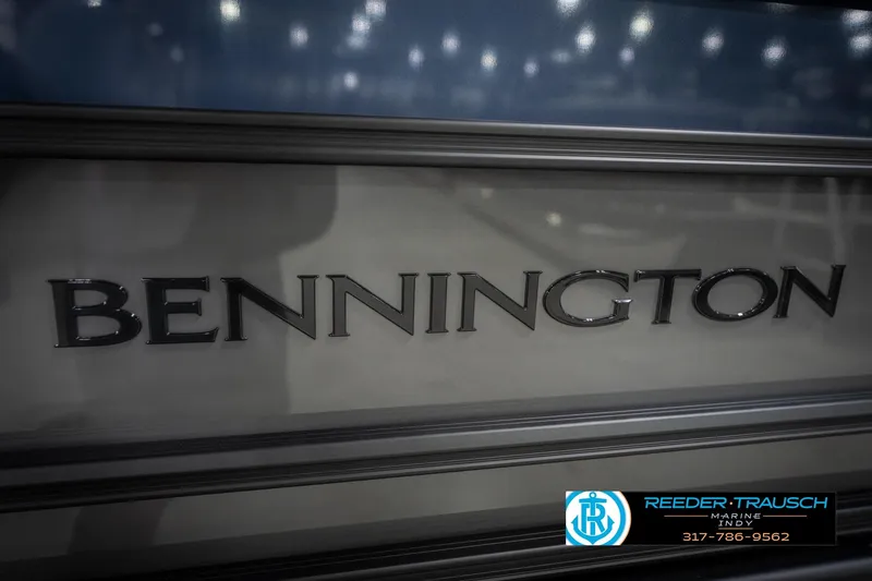 Slide: The Image of Close-up of 2026 Bennington 23 SLJ boat logo with Reeder-Trausch Marine branding. - 52