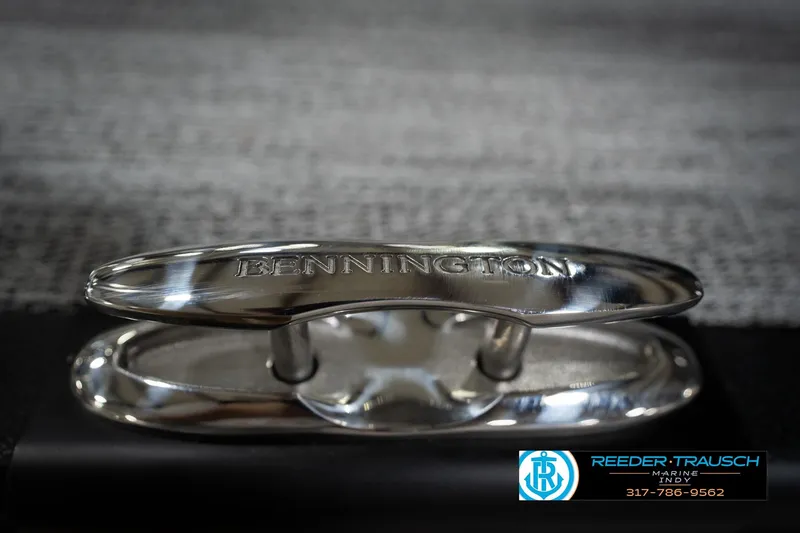 Slide: The Image of Close-up of a 2026 Bennington 23 SLJ boat cleat with Reeder-Trausch Marine logo. - 57