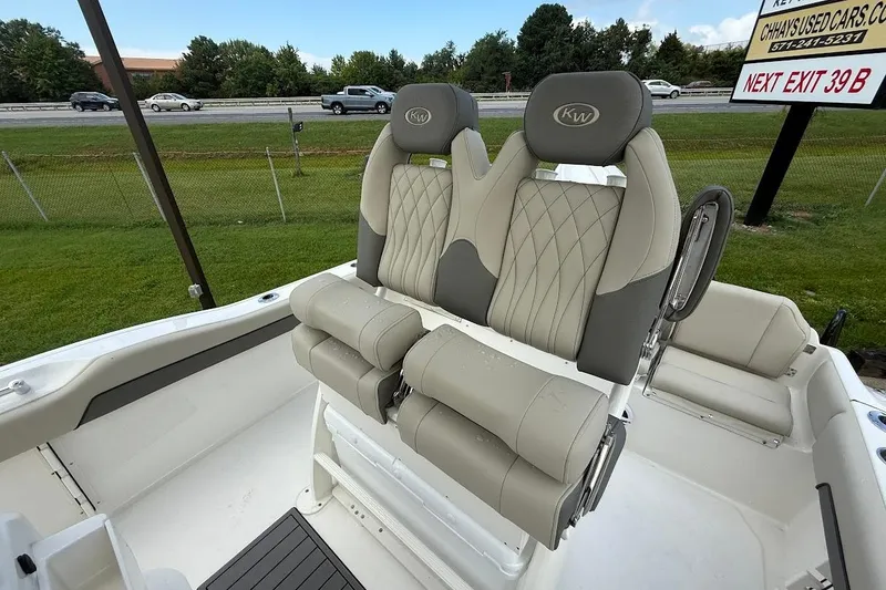 Slide: The Image of 2026 Key West 219 FS boat interior with dual cushioned seats and elegant design. - 12
