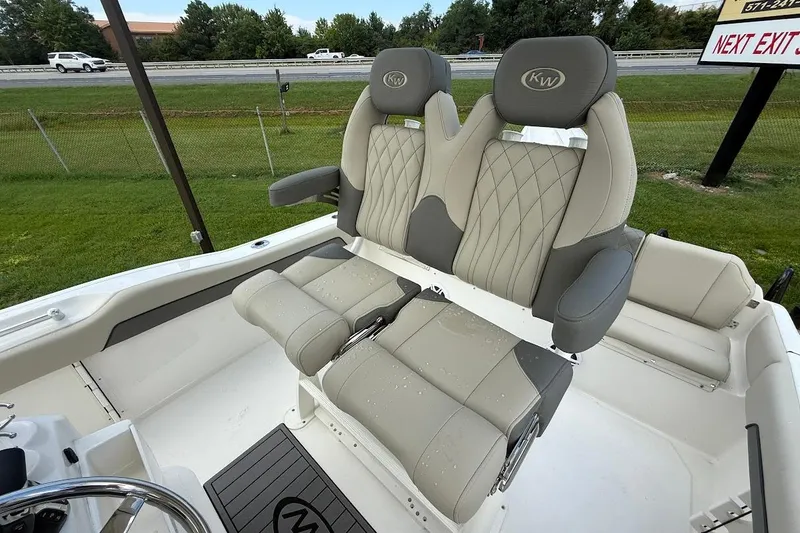 Slide: The Image of 2026 Key West 219 FS boat seats with elegant gray and beige upholstery. - 13