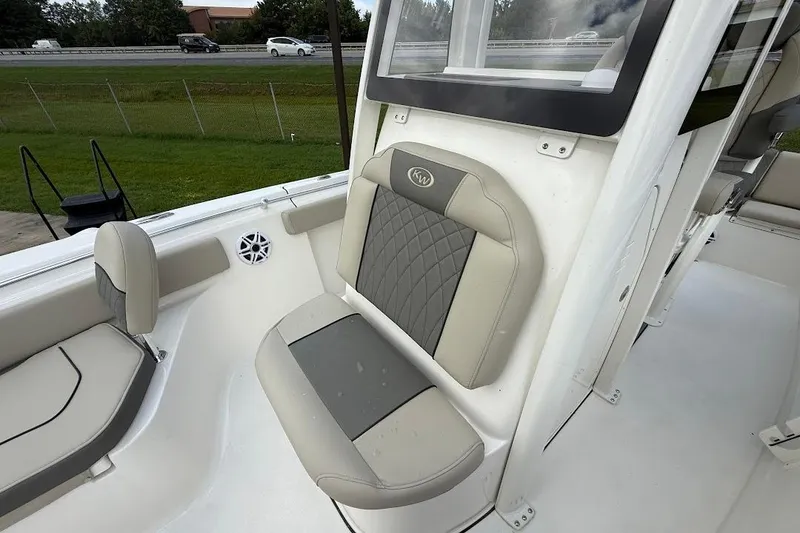 Slide: The Image of 2026 Key West 219 FS boat interior with cushioned seating and modern design. - 19