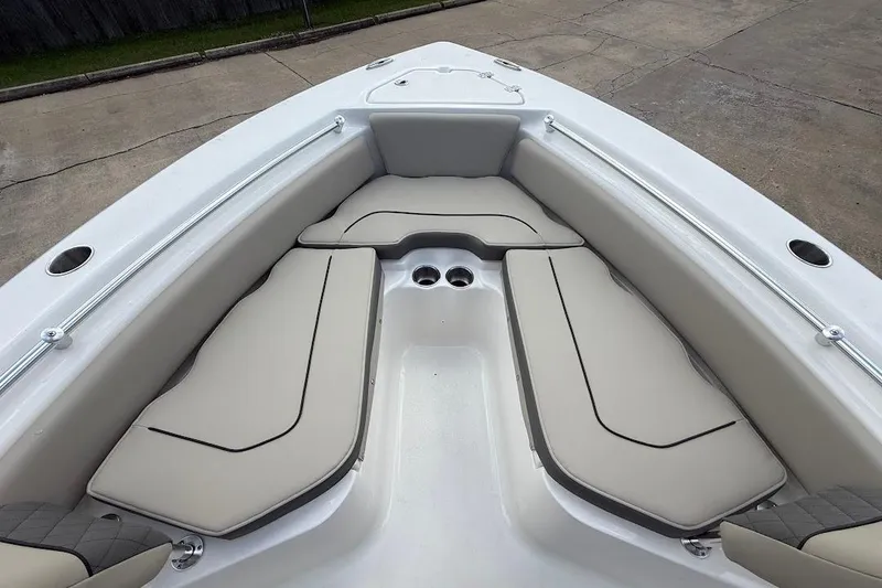 Slide: The Image of 2026 Key West 219 FS boat interior with cushioned seating and cup holders. - 21