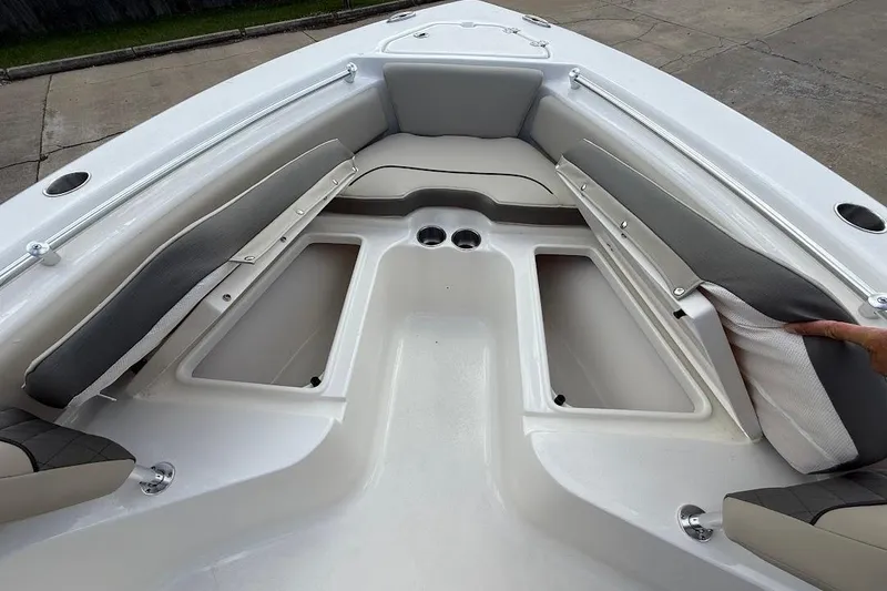 Slide: The Image of 2026 Key West 219 FS boat interior with cushioned seating and storage compartments. - 22