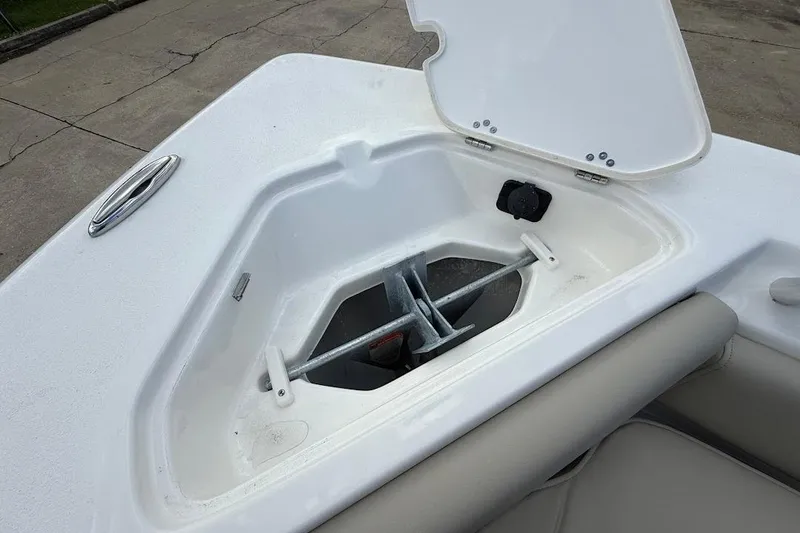 Slide: The Image of Open anchor compartment on 2026 Key West 219 FS boat, showcasing storage design. - 24